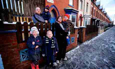 Lorna and Stuart Holden with their four children outside their house in Hartlepool. The spare bedroom tax could lead to their housing benefit being docked by up to 25%. Photographs: Christopher Thomond for the Guardian