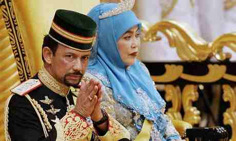 The Sultan of Brunei with Queen Saleha. 'Last year the Independent revealed that the Sultan of Brunei pays only £32 a month more for his pleasure dome in Kensington Palace Gardens than some of the poorest people in the same London borough.' Photograph: Roslan Rahman/AFP/Getty Images