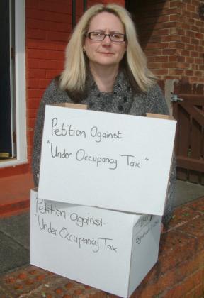 Dawn Thomas with the boxes of petitions
