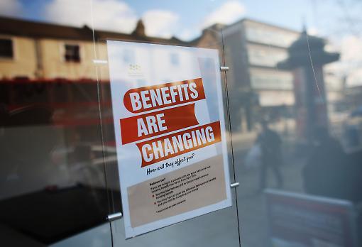 A notice about the changes to the benefits system. There are other cuts that aren't making so much news. Photograph: Getty Images