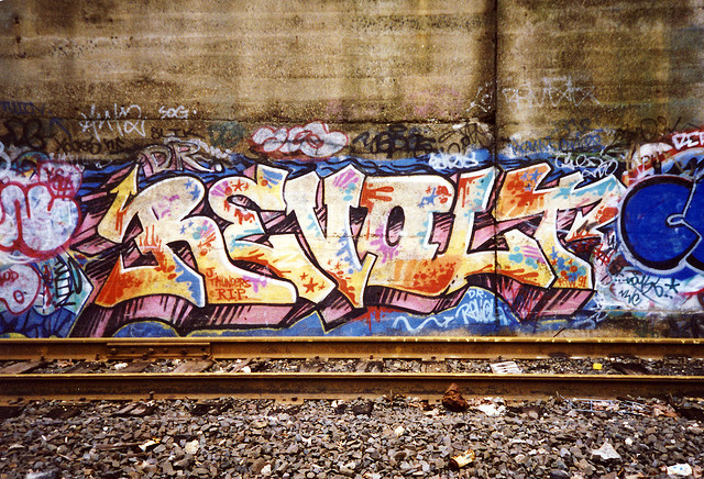 Revolt-graffiti-and-train-tracks